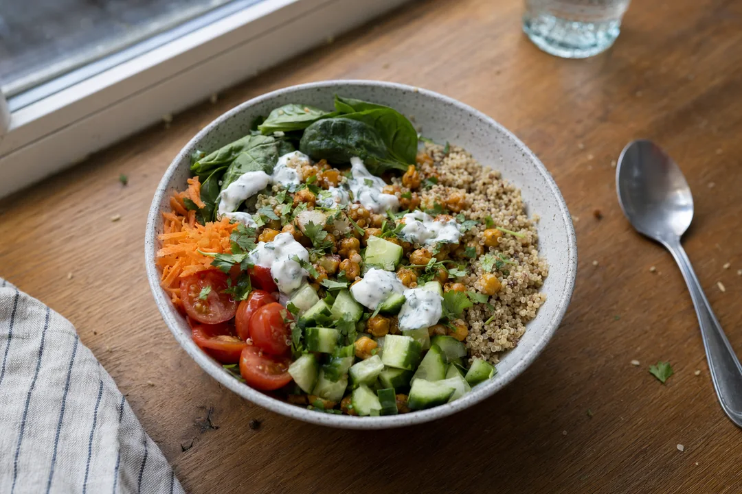 Quinoa chickpea power bowl with yogurt herb dressing